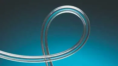A clear, glossy plastic tube curved into a smooth loop, set against a gradient background from dark charcoal to turquoise blue.